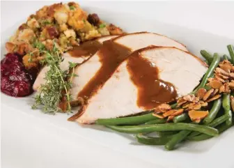  ?? PROVIDED PHOTO ?? The Thanksgivi­ng dinner from Perry’s Steakhouse & Grille.