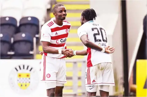  ??  ?? MOMENT OF RELIEF . . . Zimbabwe internatio­nal forward, David Moyo (number 20) an his Hamilton Academical teammate, go for the Lacazette/Aubameyang celebratio­n after the Warriors forward scored for Scottish side Hamilton Academical in a league match on Saturday