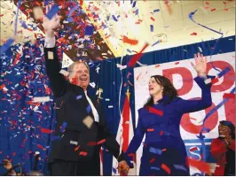  ?? Associated Press photo ?? Democratic candidate for U.S. Senate Doug Jones and his wife Louise wave to supporters before speaking Tuesday in Birmingham, Ala. Jones defeated Republican Roy Moore, a one-time GOP pariah who was embraced by the Republican Party and the president...