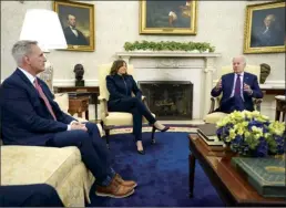  ?? AP photo ?? Speaker of the House Kevin McCarthy of Calif., (left) and Vice President Kamala Harris listen as President Joe Biden speaks during a meeting with Congressio­nal leaders in the Oval Office of the White House on Tuesday in Washington.