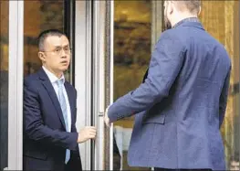  ?? Ken Lambert Seattle Times ?? IN THE LATEST cryptocurr­ency scandal, Binance CEO Changpeng Zhao, left, pleaded guilty to a money-laundering charge and violating U.S. sanctions.