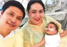  ??  ?? Romeo Meneses with his wife and son Ethan, who is much better now and celebrated his first birthday last week.