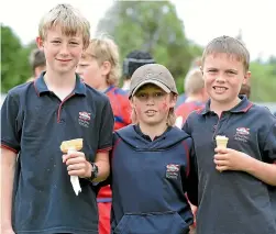  ?? ROBYN EDIE/STUFF ?? Otautau School pupils Tristan Morris, 10, Angus Levett, 10, and Jacob Calvert, 9, watching the Jonty Carran Memorial tournament action at Otautau.