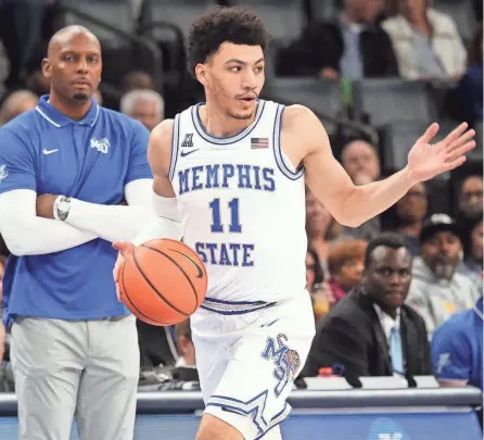  ?? PETRE THOMAS/USA TODAY SPORTS ?? Memphis guard Jahvon Quinerly dribbles up the court as Tigers head coach Penny Hardaway watches during the first half against Rice Owls on Jan. 31 at Fedexforum.