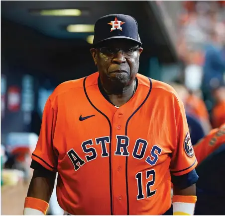  ?? DAVID J. PHILLIP/AP ?? Astros manager Dusty Baker, walking across the dugout in Game 2, is well aware that his team is playing perfect ball at the perfect time.