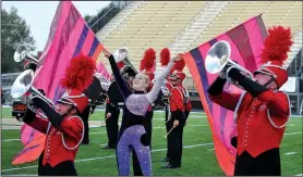  ?? NWA Democrat-Gazette/FILE PHOTO ?? Drum Corps members from Music City of Nashville, Tenn., perform during July 2015’s Northwest Arkansas Music on the Move event at Bentonvill­e High School. The event was part of the 2015 Drum Corps Internatio­nal Tour featuring the best drum corps from...