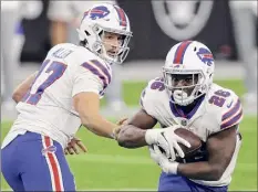  ?? Isaac Brekken / Associated Press ?? Devin Singletary, right, and the Bills have been held to fewer than 100 yards on the ground in three straight games.