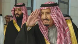  ?? (Reuters) ?? SAUDI ARABIA’S King Salman arrives to deliver an address in Riyadh yesterday, as Crown Prince Muhammad bin Salman stands next to him.