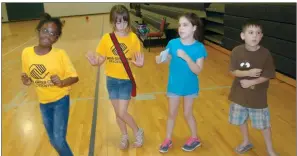  ??  ?? Boys &amp; Girls Club of Jacksonvil­le members Makeda Toombs, from left, Olivia Martineau, Kaila Kimbrell and Tyler Kimbrell show off their dance skills. A $50,000 grant that the club received will help with security for these children, as well as all the members and staff.