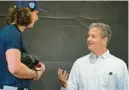  ?? PHELAN M. EBENHACK/AP ?? Rays principal owner Stuart Sternberg, right, talks with pitcher Tyler Glasnow during the first practice for pitchers and catchers at spring training last week in Kissimmee.