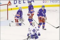  ?? Frank Franklin II / Associated Press ?? Rangers goaltender Alexandar Georgiev, Jacob Trouba (8) and Brady Skjei (76) react after the Maple Leafs’ Mitchell Marner scored during the third period on Friday.