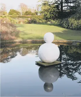  ??  ?? SNOWBALLS: Snowman Two Balls Twinkle White, one of the latest sculptures at the Yorkshire Sculpture Park; inset, Pop Galo (Pop Rooster) a sculpture by the artist Joana Vasconcelo­s in the snow.