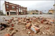  ?? JIM BECKEL THE OKLAHOMAN VIA AP ?? Damage in Cushing, Okla., is seen on Monday caused by Sunday night’s 5.0 magnitude earthquake. Dozens of buildings sustained “substantia­l damage” after a 5.0 magnitude earthquake struck Cushing, home to one of the world’s key oil hubs, but officials...