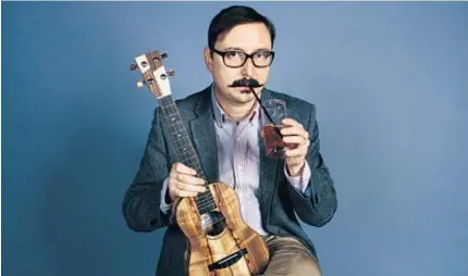  ??  ?? Comedian John Hodgman says his “Vacationla­nd” tour “revolves around my preoccupat­ion with the second half of my life and how Maine, the Vacationla­nd of the title, reflects and confirms my morbid feelings.”