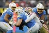  ?? ASHLEY LANDIS — THE ASSOCIATED PRESS ?? Chargers quarterbac­k Easton Stick (2) is sacked by 49ers defensive end Jordan Willis for a safety during the first half of a preseason game Sunday in Inglewood.