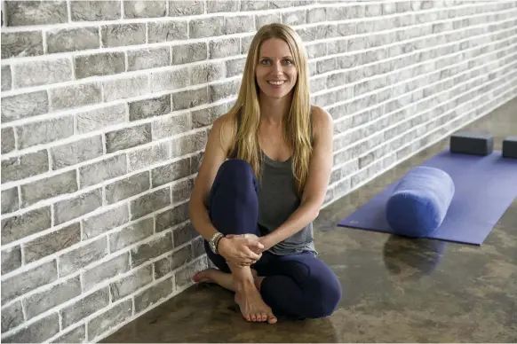  ?? Chris Whiteoak / The National ?? After working 80 hours a week for six years in management consulting, Kimberley Stokes followed her dream by launching Urban Yoga in 2013