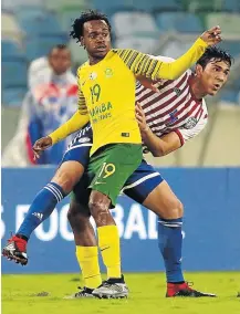  ?? Picture: GALLO IMAGES/ANESH DEBIKY ?? A CLOSE CALL: Bafana’s Percy Tau in action during the Nelson Mandela Challenge match against Paraguay at Moses Mabhida Stadium.