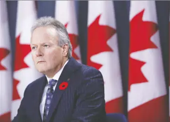  ?? DAVID KAWAI/BLOOMBERG ?? BOC governor Stephen Poloz wants politician­s to do their part in offsetting the damage caused by the trade wars, or risk setting off Canada’s household-debt bomb, writes Kevin Carmichael.