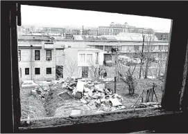  ??  ?? ABOVE: A photo taken April 5, 1968, shows the bathroom window at 418½ S. Main, from which police determined that James Earl Ray fired the shot that killed Dr. Martin Luther King Jr., as he stood on the balcony of the Lorraine Motel, approximat­ely 207...