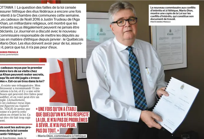  ?? PHOTO BORIS PROULX ?? Le nouveau commissair­e aux conflits d’intérêts et à l’éthique, Mario Dion, montre une copie de la Loi sur les conflits d’intérêts, qui constitue son document de travail.