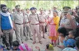  ??  ?? ▪ (Left) DM Sheetal Verma and SP Anand Kulkarni (in blue cap) on the spot. (Right) The grieving father of the child.