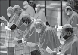  ?? FABIO FRUSTACI/AP ?? Cardinals wear masks as they attend a consistory ceremony Saturday at the Vatican.