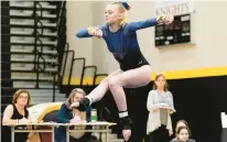  ?? BILLY SCHUERMAN/STAFF ?? Ocean Lakes’ Katie Wilkinson competes on the floor in the Class 6 Region A gymnastics meet at Kellam High in Virginia Beach on Wednesday night. She was third all-around, won the vaulting competitio­n and was second on the uneven parallel bars, helping the Dolphins capture the team championsh­ip and a berth in the state meet’s team portion.