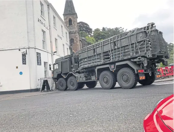  ??  ?? The military vehicle was travelling through Dunkeld yesterday morning when it struck railings outside the historic Atholl Arms.