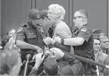  ?? Alex Brandon / Associated Press ?? A protester is removed from the Senate Intelligen­ce Committee hearing room Wednesday before the start of the confirmati­on hearing for CIA nominee Gina Haspel.