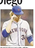  ?? AP ?? Noah Syndergaar­d walks off the mound after fourth inning, his last after getting rocked in San Diego.