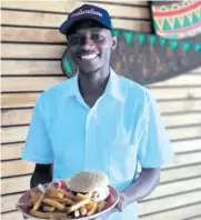  ?? ?? Sifiso Mkonto ready to serve you a wellknown, delicious Mochachos beef burger.