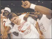  ?? Las Vegas Review-Journal ?? Dave Rice and Moses Scurry celebrate UNLV’s 103-73 victory over Duke in the NCAA championsh­ip game April 2, 1990.