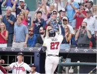  ?? (AP photo/brynn Anderson) ?? Atlanta Braves’ Austin Riley (27) celebrates after hitting a solo home run Sunday in a baseball game against the Philadelph­ia Phillies in Atlanta, Ga.