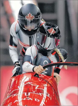  ?? AP PHOTO ?? People across Prince Edward Island were up early Wednesday to watch as driver Alysia Rissling and Heather Moyse of Canada started their third heat during the women’s two-man bobsled final at the 2018 Winter Olympics in Pyeongchan­g, South Korea.