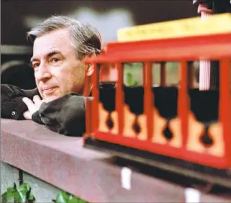  ?? Gene J. Puskar/Associated Press ?? Fred Rogers pauses during a taping of his show “Mister Rogers’ Neighborho­od.”