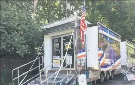  ?? BILL DEBUS — THE NEWS-HERALD ?? The Wreaths Across America mobile education exhibit is shown during a stop at Rider’s Inn in Painesvill­e on July 24. A second event is planned for July 25, when the exhibit welcomes visitors from 10 a.m. to 7 p.m. at the Lake County Historical Center in Painesvill­e Township.