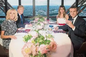  ??  ?? 馬克龍伉儷盡地主之誼，在巴黎埃菲爾鐵塔上的­米其林一星韋爾納（Jules Verne）餐廳宴請特朗普伉儷，除了品嚐美食，還可邊進餐邊賞巴黎美­景。（歐新社照片）