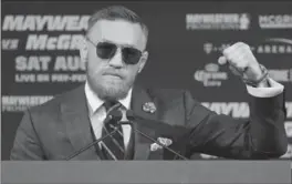  ?? JOHN LOCHER, THE ASSOCIATED PRESS ?? Conor McGregor reacts at a news conference in Las Vegas on Wednesday.