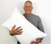  ?? ?? Alexander Miles, inventor of the Gx Pillow pictured with his invention