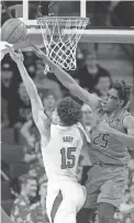  ??  ?? Maryland’s Jalen Smith defends a shot by Nebraska’s Isaiah Roby on Wednesday in Lincoln, Neb. NATI HARNIK/AP