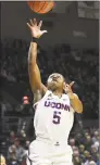  ?? Stephen Dunn / Associated Press ?? UConn’s Crystal Dangerfiel­d shoots during the second half against California on Sunday in Storrs.