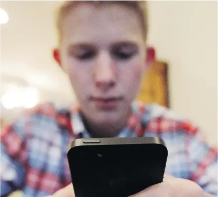  ?? — AP FILES ?? Mark Risinger, 16, says he spends about four hours a day on his smartphone doing homework, using Facebook and YouTube and watching movies. But there’s good news for parents who think fours hours is too much. There are new tools out there that can help...