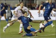  ?? JEFF CHIU — THE ASSOCIATED PRESS FILE ?? In this Tuesday file photo, United States’ Tobin Heath, bottom, scores a goal in front of Chile’s Geraldine Leyton during the first half of an internatio­nal friendly soccer match in San Jose Less than a year ago Tobin Heath lamented that being injured was the “worst thing in the whole entire world.”