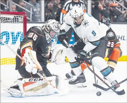  ?? KYUSUNG GONG ?? Evander Kane, battling for the puck in front of Ducks goaltender John Gibson, had quite a playoff debut, scoring twice in the Sharks’ win.