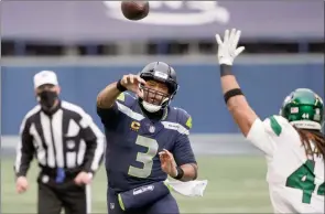  ?? The Associated Press ?? Seattle Seahawks quarterbac­k Russell Wilson throws against the New York Jets during the first half of an NFL game, Sunday, in Seattle.