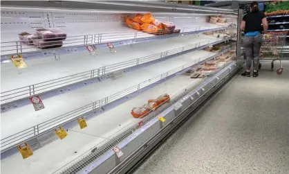  ?? Photograph: Mick Tsikas/AAP ?? Empty shelves at a Sydney supermarke­t on Friday. Critical workers in NSW will no longer need toisolate even if they are a close contact of a positive Covid case.