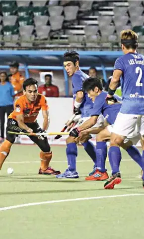  ??  ?? A Malaysian player (left) takes on three South Korean players during their match in Muscat on Monday.