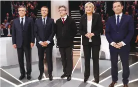  ??  ?? AUBERVILLI­ERS: From left to right, Conservati­ve presidenti­al candidate Francois Fillon, Independen­t centrist presidenti­al candidate for the presidenti­al election Emmanuel Macron, Far-left presidenti­al candidate for the presidenti­al election Jean-Luc Melenchon, Far-right presidenti­al candidate for the presidenti­al election Marine Le Pen and Socialist candidate for the presidenti­al election Benoit Hamon pose for a group photo prior to a television debate at French TV station TF1 on March 20, 2017. — AP
