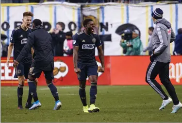  ?? CHRIS SZAGOLA — THE ASSOCIATED PRESS ?? Philadelph­ia Union’s Mark McKenzie, center, reacts to a win with teammates during extra time of an MLS soccer Eastern Conference first-round playoff match against the New York Red Bulls, Sunday, Oct. 20, 2019, in Chester, Pa.