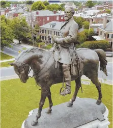  ?? AP PHOTO ?? FLASHPOINT: A statue of Gen. Robert E. Lee still occupies a prominent perch in Richmond, Va.